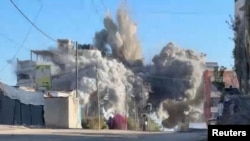Газа тилкесиндеги Израил армиясы жасаган соккудан чыккан түтүн. 28-ноябрь, 2024-жыл. 