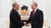 Russian President Vladimir Putin (right) and former Kazakh President Nursultan Nazarbaev meet in Moscow in March 2020.