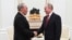 Russian President Vladimir Putin (right) and former Kazakh President Nursultan Nazarbaev meet in Moscow in March 2020.