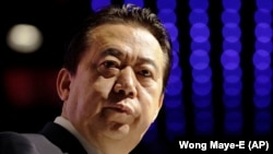 Мэн Хунвэй в более счастливые для него времена. Сингапур, июль 2017 года.