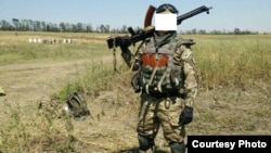 Беларускі салдат з украінскага добраахвотніцкага палку «Азоў», баец атраду «Пагоня» з пазыўным «Кім». 