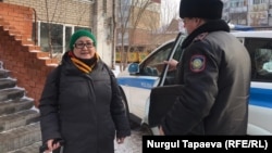 Aigul Otepova is shown as she is removed from her apartment before being taken to a psychiatric clinic in Nur-Sultan on November 23.