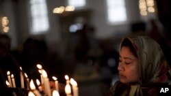 Свечи в память о жертвах теракта в Норвегии