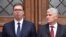 Serbian President Aleksandar Vucic (left) and the chairman of Bosnia's three-man presidency, Dragan Covic, in Sarajevo on September 7.