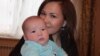 Алия Турусбекова, жена оппозиционного политика Владимира Козлова, с сыном Аленом.