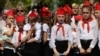 Ukraine - Children in red caps and ties, inspired by the Soviet Pioneers movement, taking part in a meeting of the youth movement "Patriot", an organization of the self-proclaimed People's Republic of Donetsk (DNR) in the outskirts of Donetsk, May 26, 201