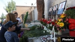 Armenia - Flowers are laid at a memorial in Yerevan to police officers killed during a July 2016 standoff with opposition gunmen, 17Jul2017.