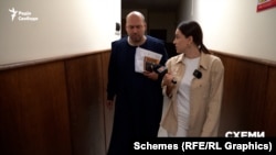 Суддя Сергій Вовк та журналістка Ольга Івлєва