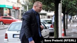 Key witness Aleksandar Sindjelic arrives at the Podgorica court.