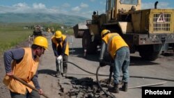 Armenia -- Workers repair a rural road, undated.