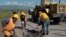 Armenia -- Workers repair a rural road, undated.