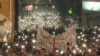 Protesters In Belgrade Light Up Night Sky During Moment Of Silence grab