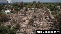 Rus basybalyjy güýçleriniň Ukrainanyň Luhansk regionynyň Priwelege şäherine urban zarbalarynyň netijeleri. 14-nji iýun, 2022 ý. 