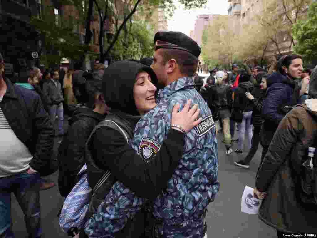 Protesters blocked a central crossroad in Yerevan. Around 60 police armed with nightsticks tried to hem them in, but with mostly young women in front, the police eventually gave up and retreated to a nearby courtyard.