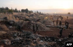 Сирия аскерлери жана өкмөтчүл күчтөр Батыш Сириядагы согуштук өңүттө. 8-октябрь