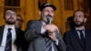 Armenian Prime Minister Nikol Pashinian (center) addresses supporters during a rally near the parliament building in Yerevan early on October 3.