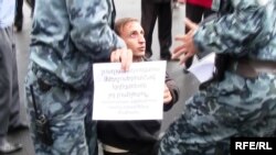 Police confront opposition protesters in Yerevan.