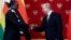 Moscow, Russia - Russia's President Vladimir Putin and imbabwean counterpart Emmerson Mnangagwa / Russia's President Vladimir Putin (R) shakes hands with his Zimbabwean counterpart Emmerson Mnangagwa during a signing ceremony at the Kremlin in Moscow, Rus