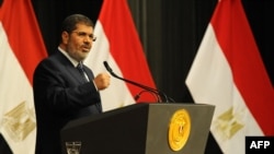 Мухаммед Мурси в бытность президентом Египта. Каир, 26 июня 2013 года.