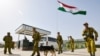 Tajik troops stand guard at the Somon border outpost on the border with Afghanistan, which also borders Uzbekistan and Turkmenistan. 