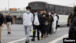 Migrants are deported back across the US border with Mexico in McAllen, Texas, on January 27. The Trump administration has been pressuring Serbia and other Balkan countries to accept migrants deported by the United States.