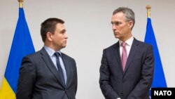 Міністр закордонних справ України Павло Клімкін та голова НАТО Єнс Столтенберґ під час зустрічі у Брюсселі. 29 січня 2015 року