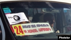 Armenia - A poster on the windscreen of a minibus urging Yerevan residents to defy higher fares, 24Jul2013.