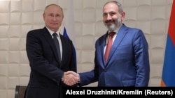 ARMENIA -- Russian President Vladimir Putin shakes hands with Armenian Prime Minister Nikol Pashinian during a meeting on the sidelines of a session of the Supreme Eurasian Economic Council in Yerevan, Armenia October 1, 2019.