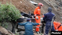 Armenia - A rescue team works at the site of a major landslide, 03Oct2011.