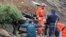 Armenia - A rescue team works at the site of a major landslide, 03Oct2011.