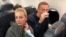 Russian opposition leader Aleksei Navalny and his wife Yulia Navalnaya are seen on board a plane during a flight from Berlin to Moscow on January 17, 2021.