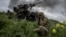 Ukrainian soldiers fire a Caesar self-propelled howitzer toward Russian troops near Avdiyivka on May 31.