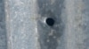 Armenia - A bullet hole on the roof of a house in the village of Khnatsakh, May 8, 2025.