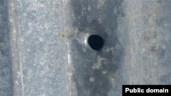 Armenia - A bullet hole on the roof of a house in the village of Khnatsakh, May 8, 2025.