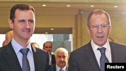 Başar al-Assad Orsýetiň daşary işler ministri Sergeý Lawrow bilen Damaskda, 7-nji fewral.