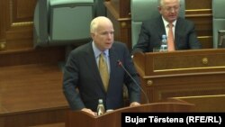 U.S. Senator John McCain addresses Kosovo's parliament in Pristina on April 13.