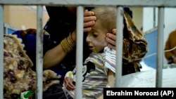 یک کودک مبتلا به سوء تغذیه در افغانستان، آرشیف