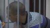 WATCH: Russian Troops On Trial For Killing Of Tajik Taxi Driver