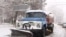 Armenia -- Municipal vehicle cleans the street in Yerevan after a heavy snowfall, Yerevan, 01Feb2011