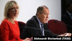 ITALY -- Russia's Foreign Minister Sergei Lavrov and Foreign Ministry spokeswoman Maria Zakharova at a press conference in Milan, December 7, 2018.
