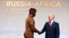 Burkina Faso's Captain Ibrahim Traore (left) and Russian President Vladimir Putin shake hands at the Russia-Africa Summit in St. Petersburg on July 27.