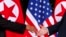 Рукопожатие Ким Чен Ына и Дональда Трампа. Остров Сентоса, Сингапур, 12 июня 2018 года