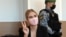 Lyubov Sobol flashes a "victory" sign in court in Moscow on March 10.