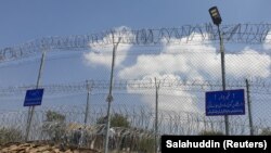 بخشی از مرز پاکستان با افغانستان که با سیم خاردار حصار کشی شده است