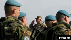 Armenia - General Yuri Khachaturov, chief of the Armenian army's General Staff, salutes troops from CSTO member states holding exercises at Marshal Bagramian shooting range, 30Sep2015.