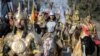Kazakhstan - Revellers ride horses during a parade as part of Navruz celebrations, an ancient holiday marking the spring equinox, in Almaty, Kazakhstan March 21, 2019.  REUTERS/Pavel Mikheyev