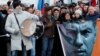 People take part in a rally to mark the anniversary of Russian opposition politician Boris Nemtsov's murder in Moscow on February 29.