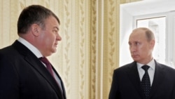 Russia -- Prime Minister Vladimir Putin (R) and Defense Minister Anatoly Serdyukov visit one of the apartments in a compound built for military officers in the city of Engels, 06Apr2012