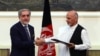 The NATO chief said both Afghan presidential candidates Abdullah Abdullah (left) and Ashraf Ghani pledged to sign the agreements in their joint message to the NATO summit in Wales on September 4.