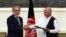 The NATO chief said both Afghan presidential candidates Abdullah Abdullah (left) and Ashraf Ghani pledged to sign the agreements in their joint message to the NATO summit in Wales on September 4.